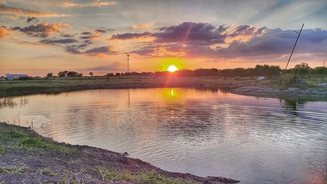 281 Country Club pond at golden hour — ATV camping evening San Antonio